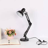 Fleksibilna lampa koja se može postaviti na sto pomoću postolja.