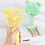 Ručni mini ventilator sa ukrasnim ušima za lično rashlađivanje.