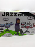 Prikazan je komplet dečijih bubnjeva iz kategorije perkusionih instrumenata.
